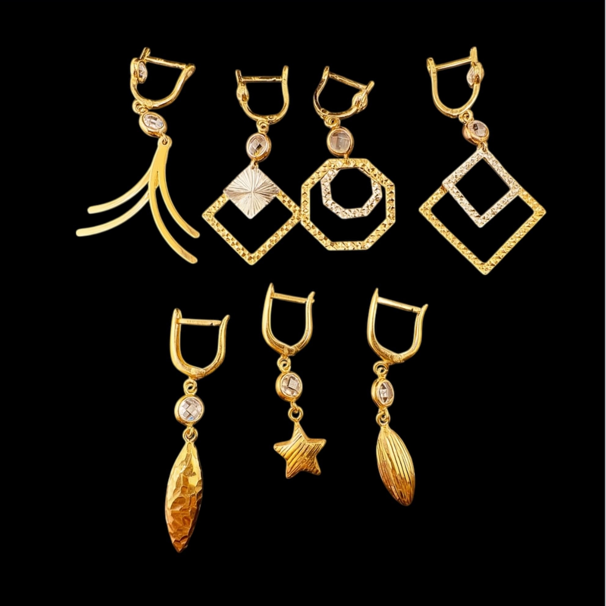 Aretes largos con cierre catalán en oro 14k en diferentes diseños colgantes con circonias. TuOro.