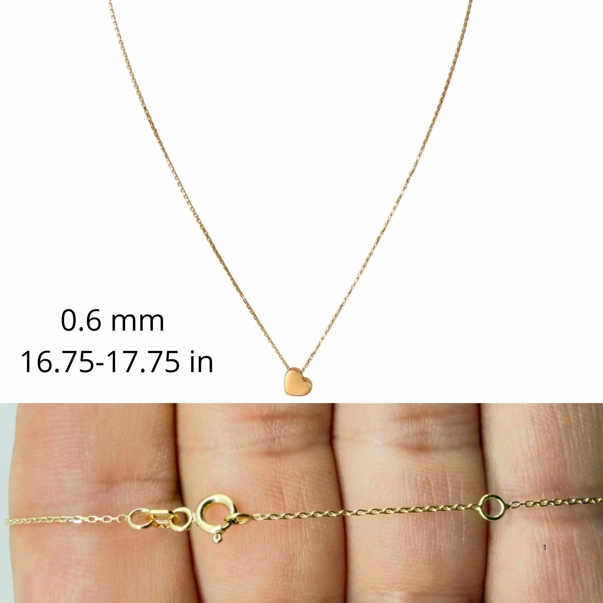 Cadena fina de oro 10K TuOro con dije de corazon y detalle del cierre redondo con argolla de ajuste.