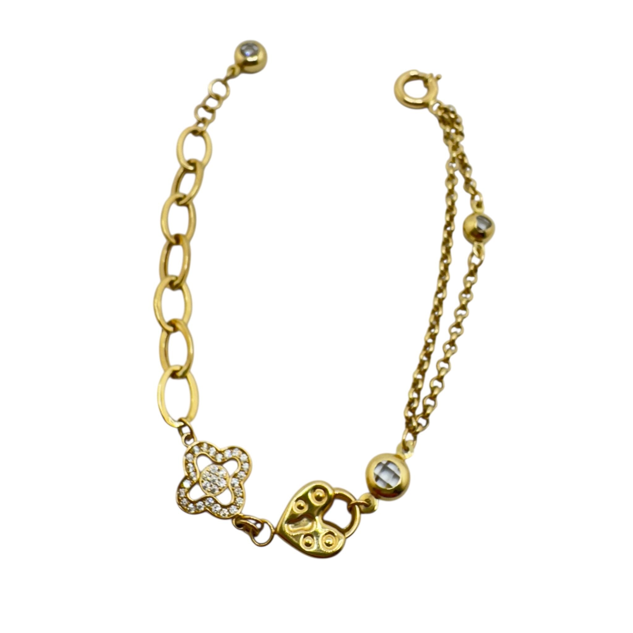 Pulsera de Oro 14K con candado y trébol decorativo de TuOro, diseño simbólico con dijes en oro amarillo.
