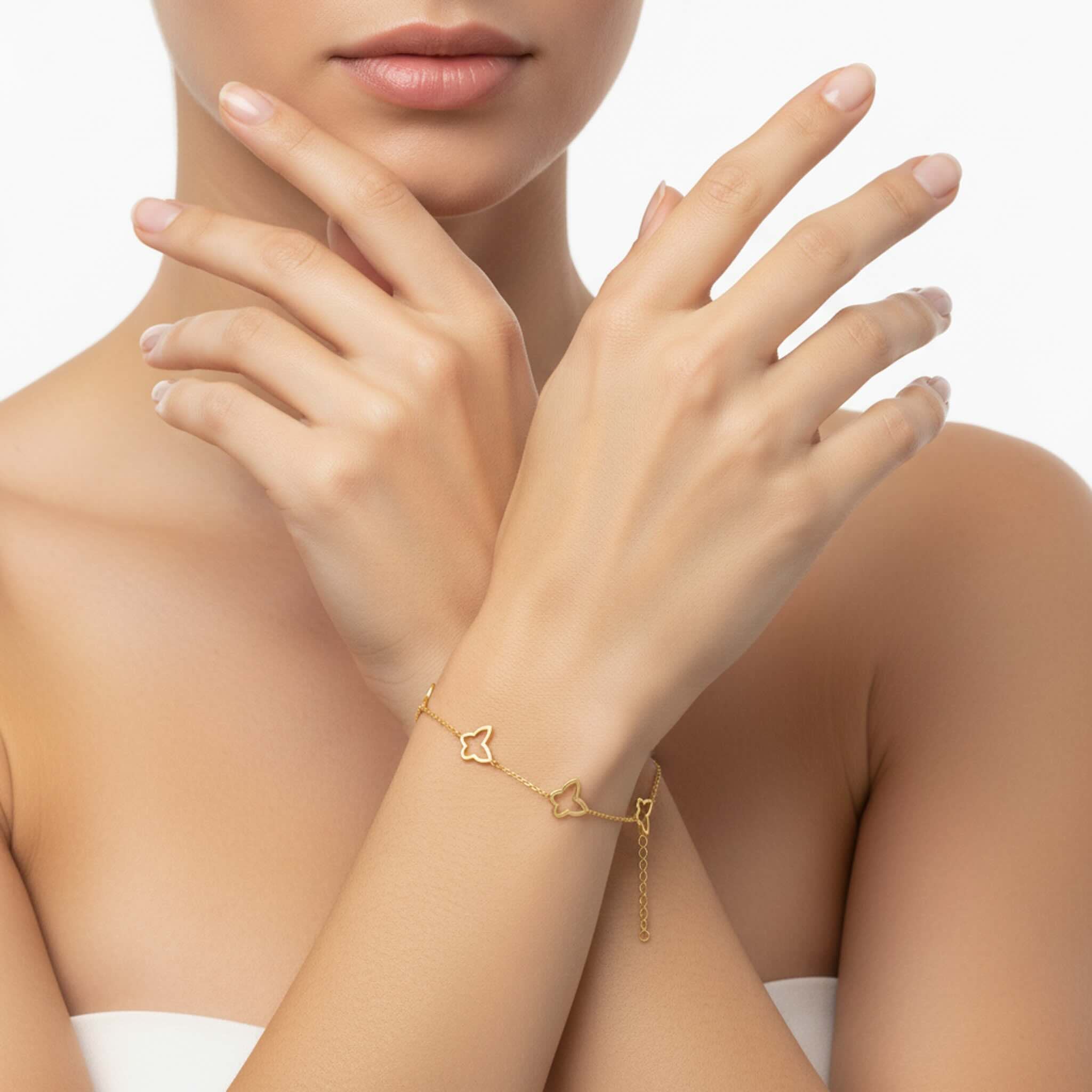 Pulsera de Oro 14K TuOro con mariposa y corazón integrados en muñeca