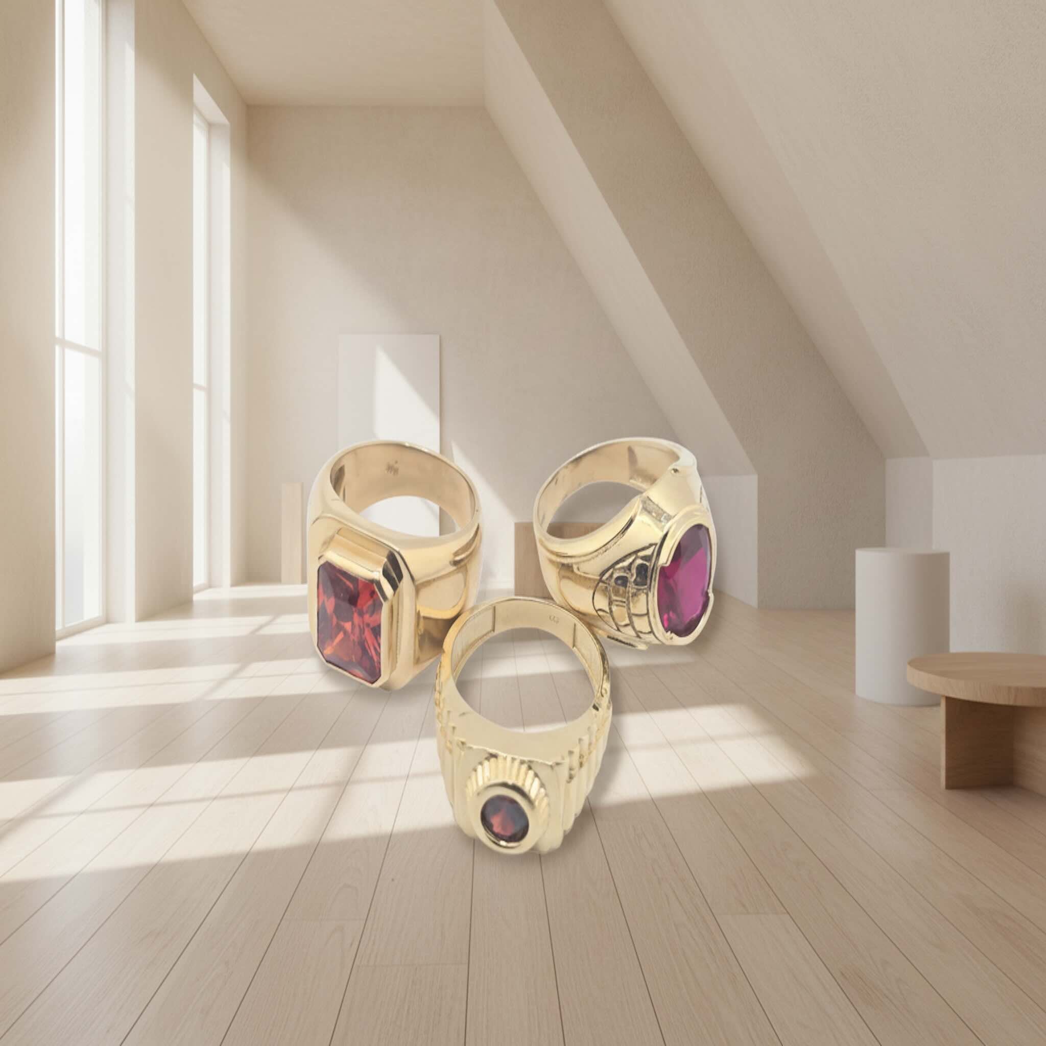 coleccion de anillos de oro 14k con circonia roja en una escena interior tuoro
