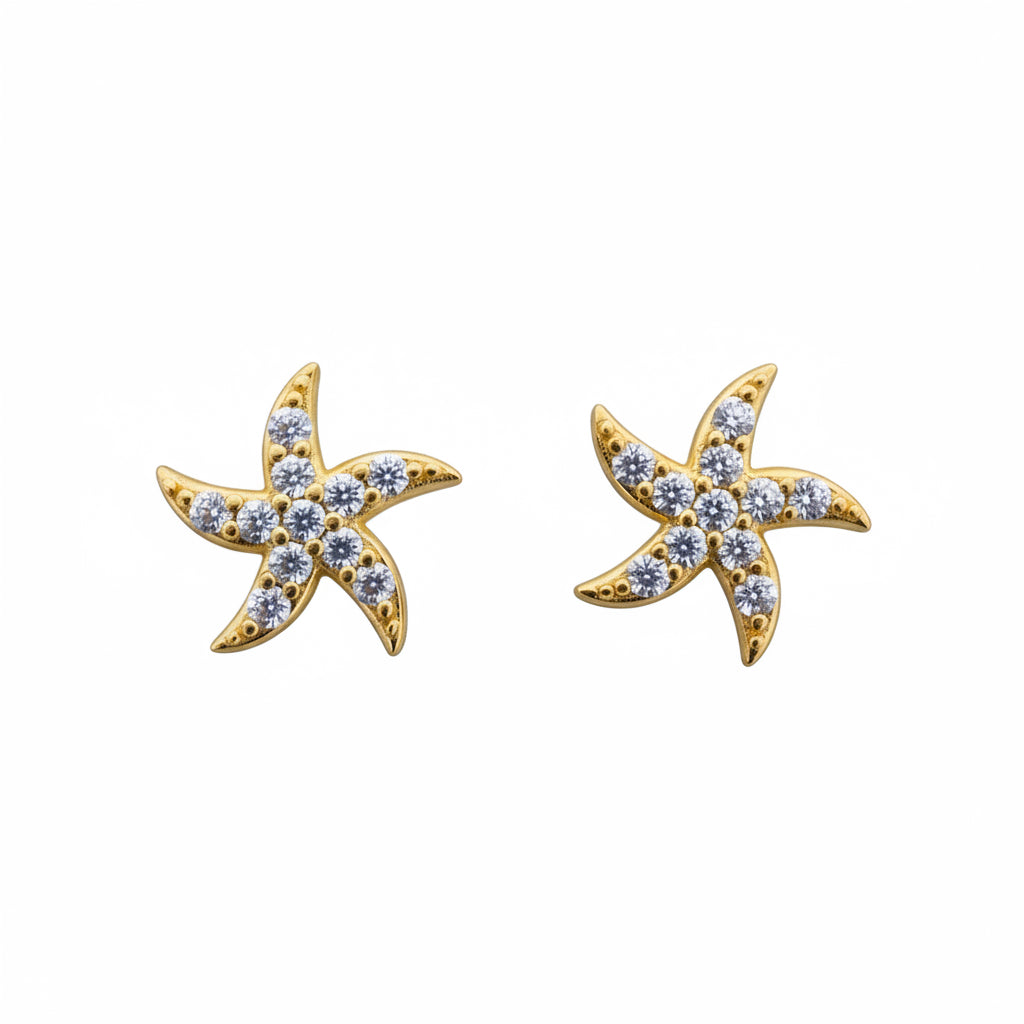 Aretes pequeños en Oro 10K con cierre de rosca, diseño estrella de mar con piedras brillantes en acabado dorado.