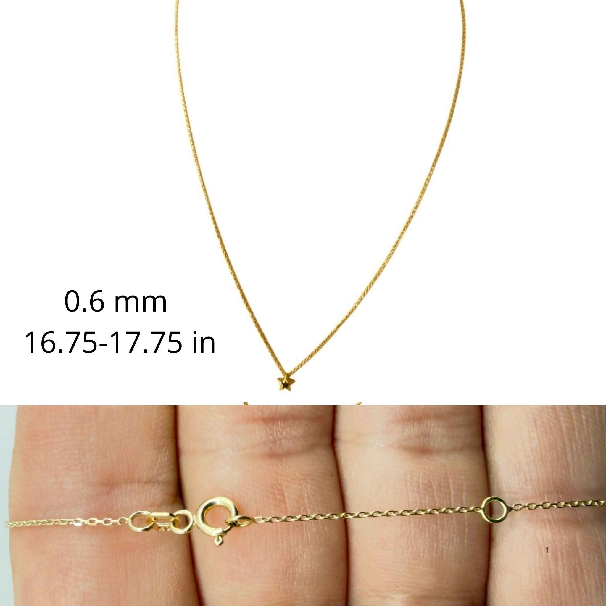 Cadena fina de oro 10K TuOro con pequeño dije de estrella, grosor de 0.6 mm, largo ajustable y detalle del cierre.