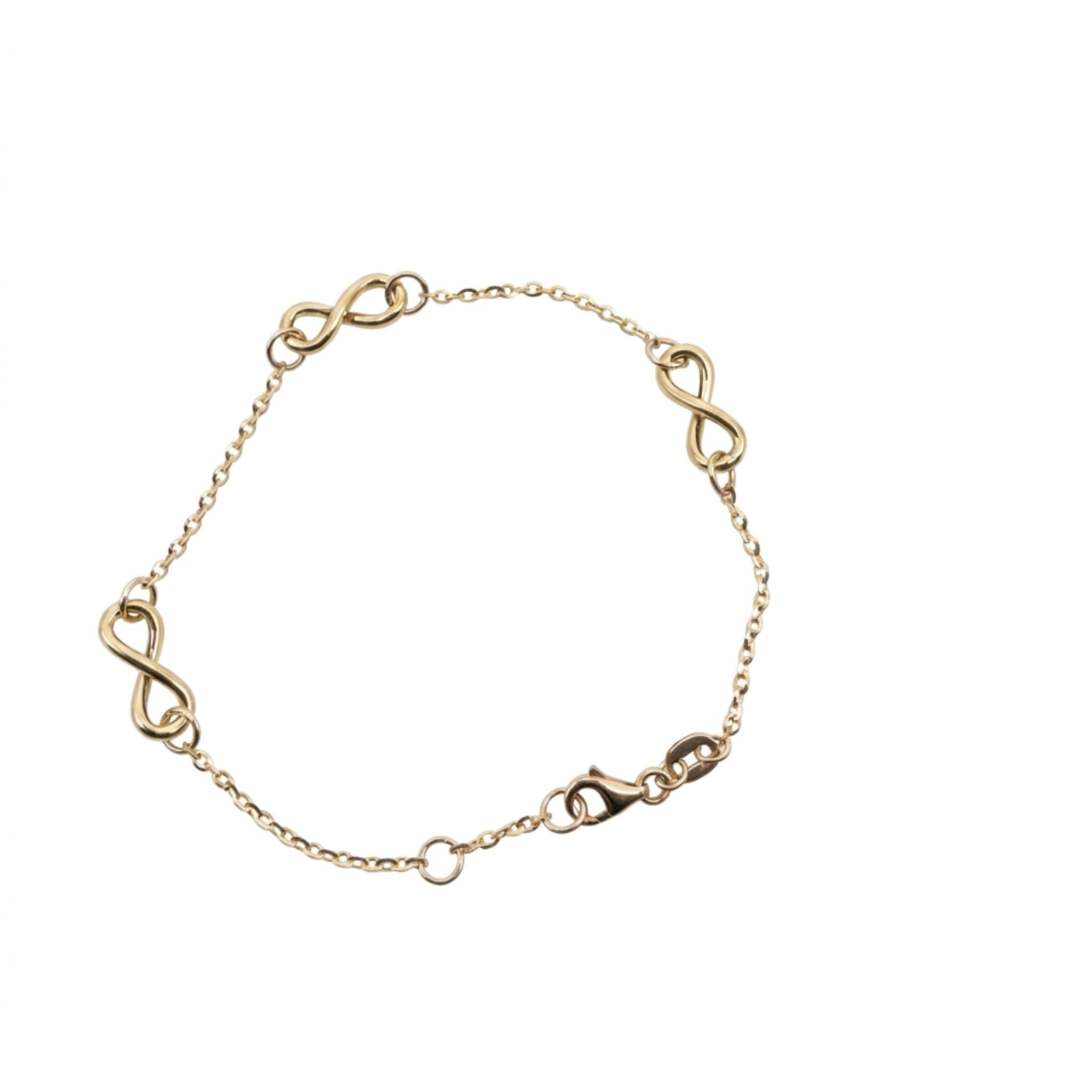 Pulsera delicada de oro 10K para mujer con varios símbolos de infinito.