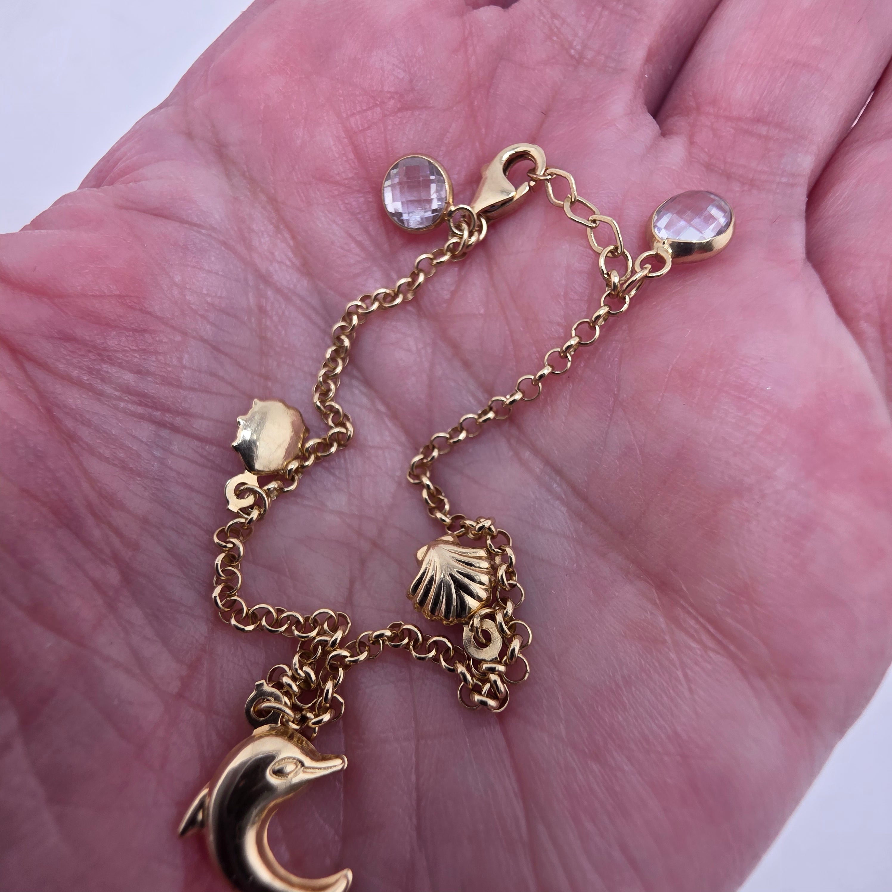 Pulsera marina en Oro 14K con cadena rolo y dijes